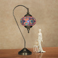 24-inch Turkish table lamp with colorful mosaic glass and curved bronze base.