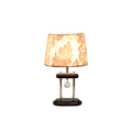 Pair of table lamps with dark wood bases, clear cylindrical supports, and beige floral fabric shades.