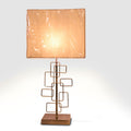 Table lamp with geometric bronze metal base and warm beige rectangular fabric shade.